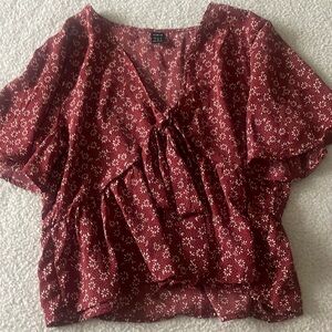 Red floral patterned short sleeved top